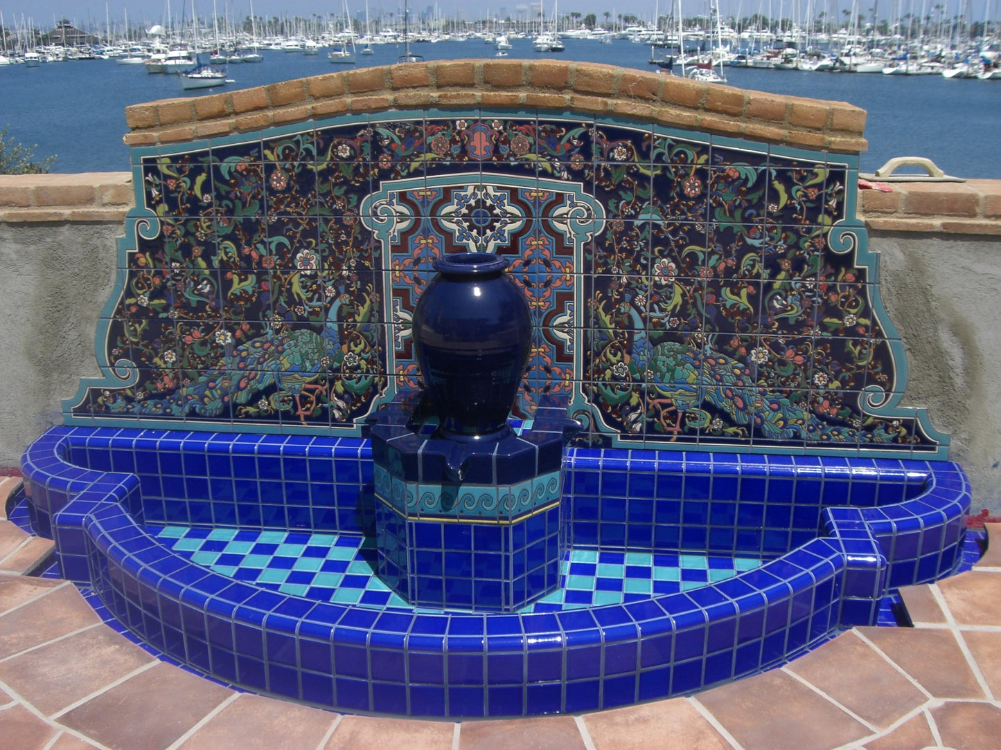 Adamsons house fountain peacock mural in Dark Blue installed on wall backsplash and fountain with harbor view