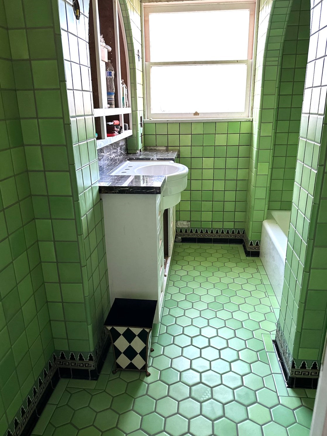 Hand-glazed green field tiles for bathroom with custom trims and cove base