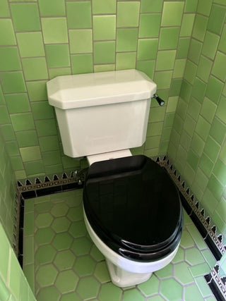 Hand-glazed green field tiles for bathroom with custom trims and cove base