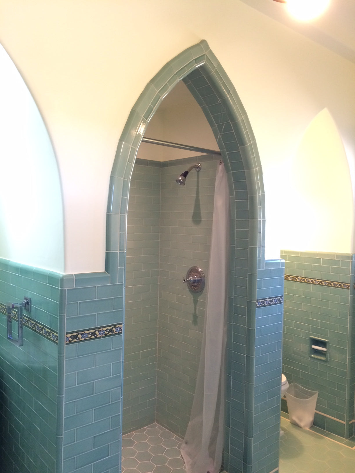 Green bathroom field tiles with deco inserts